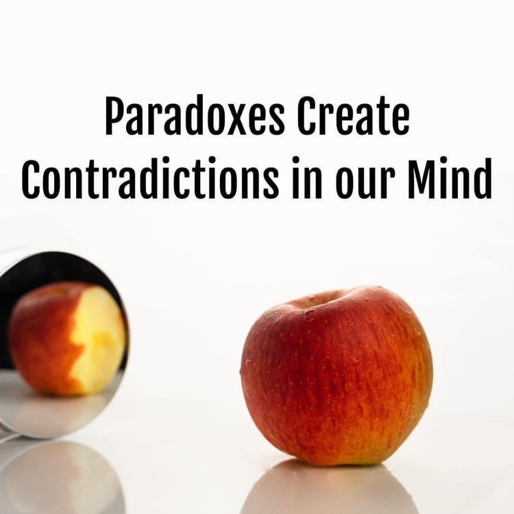 A bitten apple is placed next to a mirror, reflecting a whole apple with no bite. The text "Life Paradoxes Create Contradicti